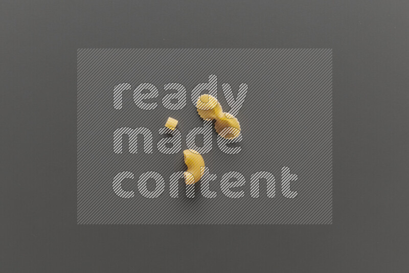 Different pasta types on grey background