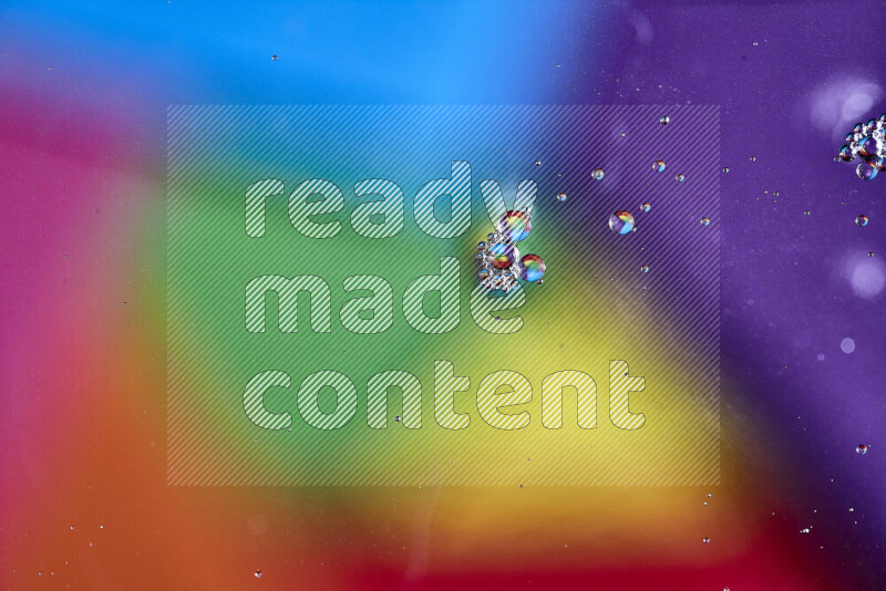 Close-ups of abstract oil bubbles on water surface in multicolors