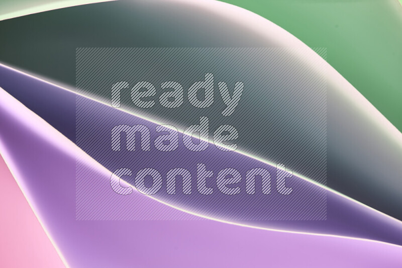 This image showcases an abstract paper art composition with paper curves in green and pink gradients created by colored light
