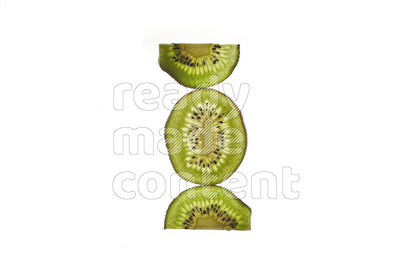 Kiwi slices on illuminated white background