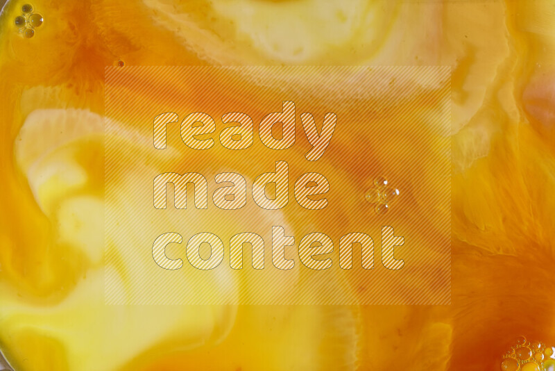 A close-up of abstract different swirling patterns in orange