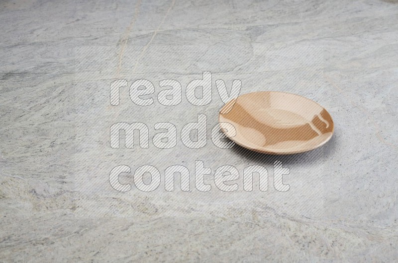 Multicolored Pottery Plate On Grey Marble Flooring