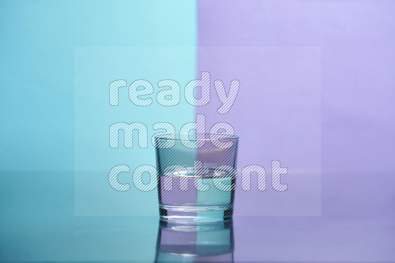 The image features a clear glassware filled with water, set against light blue and light purple background