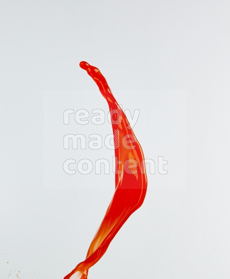 Orange liquid splash and drops on white background