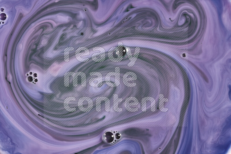 A close-up of abstract swirling patterns in blue, pink and green