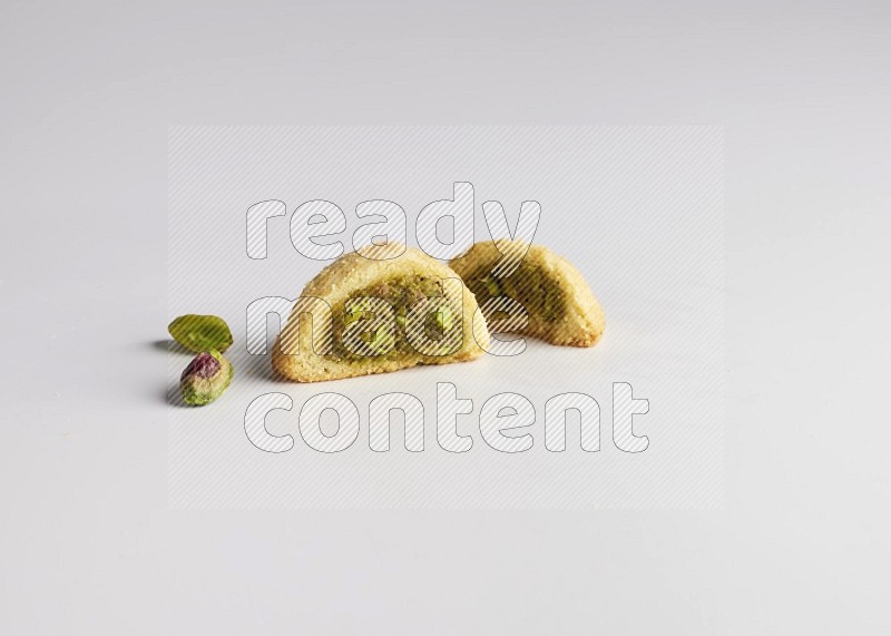 Half Maamoul filled with pistachio direct on white background