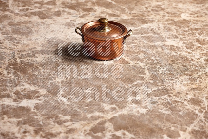 Small Copper Pot on Beige Marble Flooring, 45 degrees