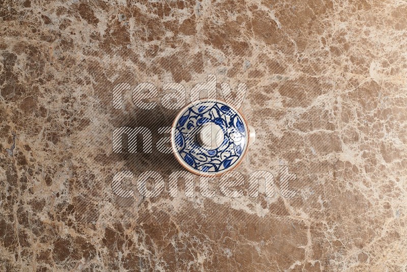 Top View Shot Of A Multicolored Pottery pot On beige Marble Flooring