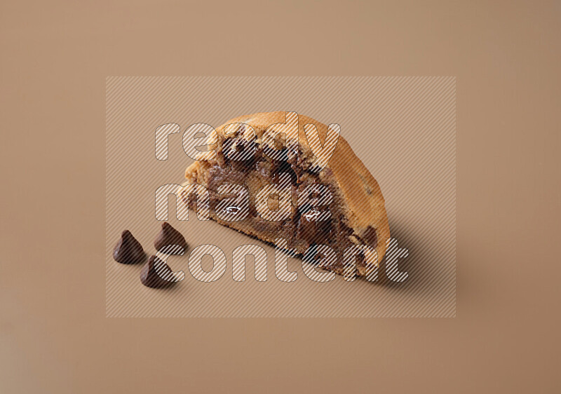 a cookie cut in half on a brown background