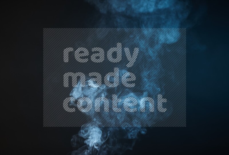 Heavy smoke in blue isolated on black background