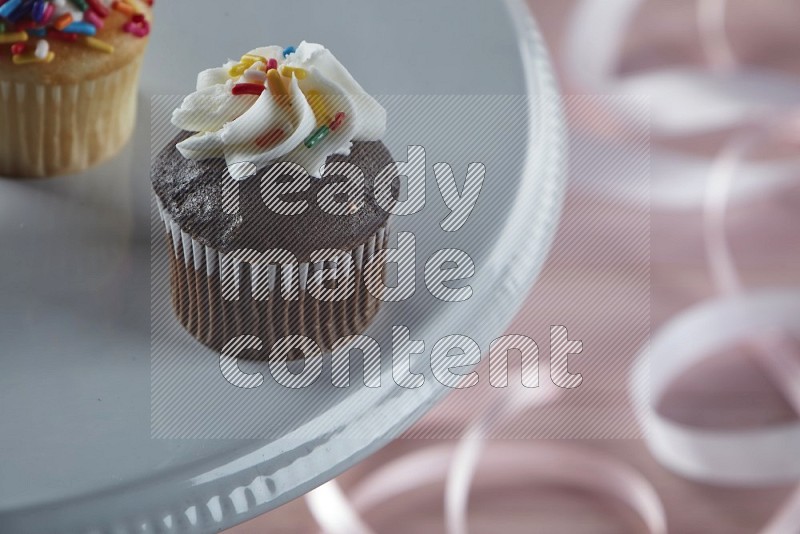Chocolate mini cupcake topped with cream