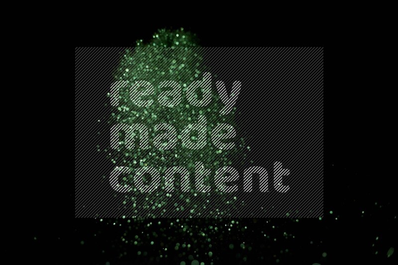 Green glitter powder isolated on black background