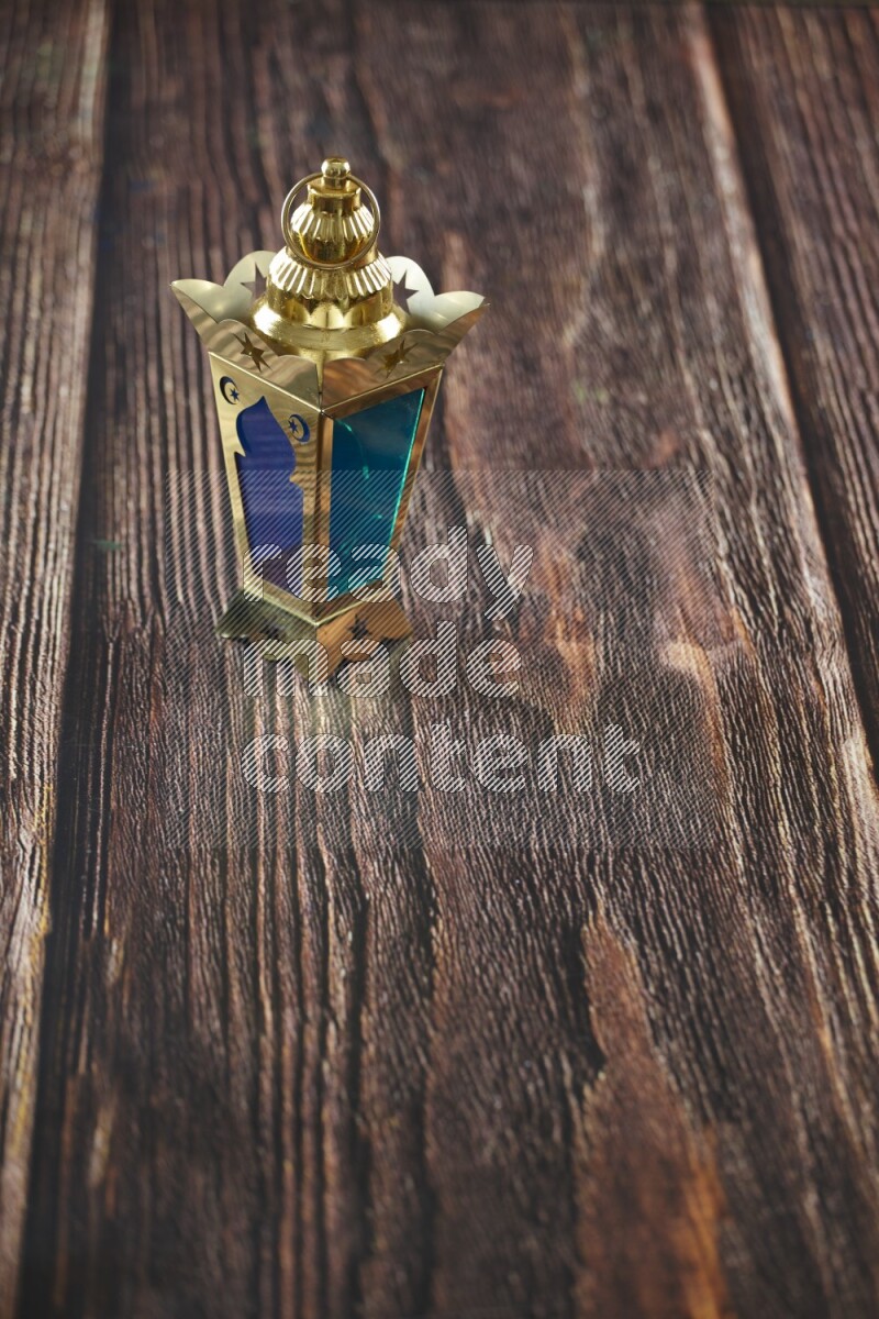 A lantern placed on a wooden background