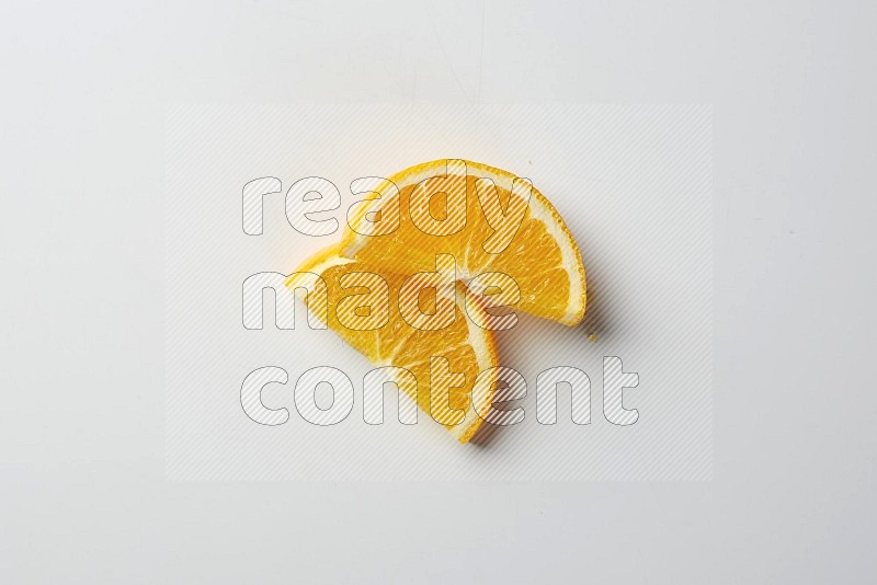 Two halves of an orange slices on white background