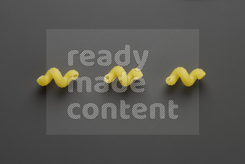 Twist pasta on grey background