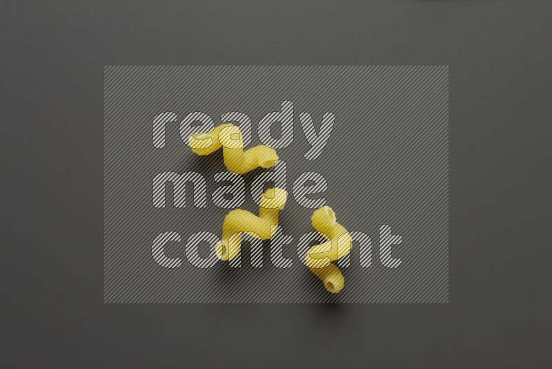 Twist pasta on grey background