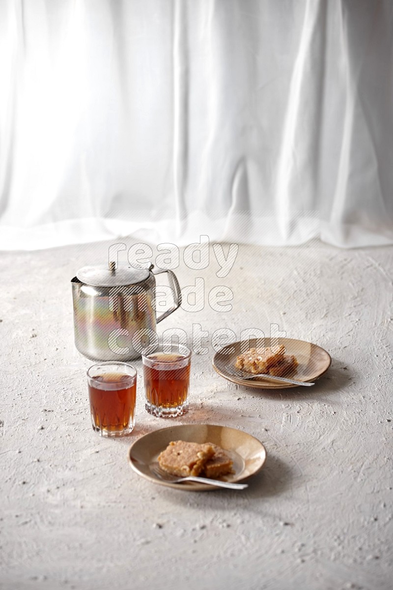 Basbousa with tea in a light setup