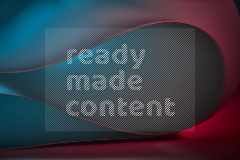 فن تجريدي يعرض منحنيات وتدرجات اللون الأزرق والأحمر مكونه بضوء ملون