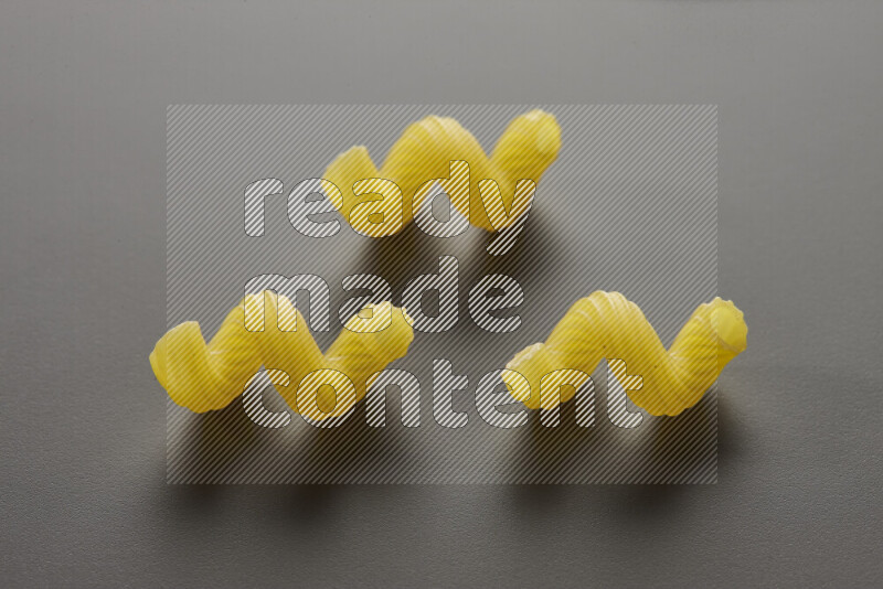 Twist pasta on grey background