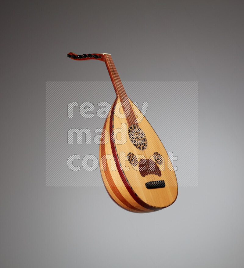 a wooden brown Oud on a gray background