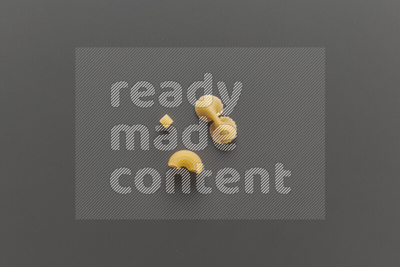 Different pasta types on grey background