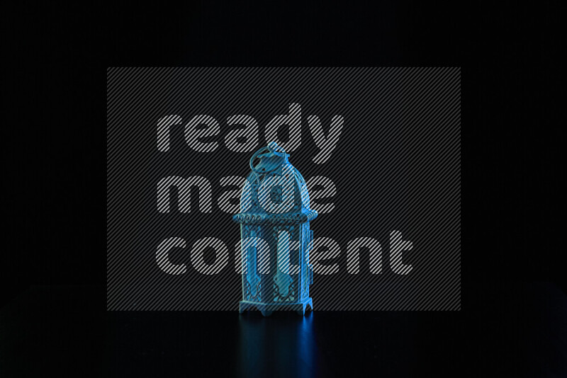 Ramadan lanterns with colored rim light against black background