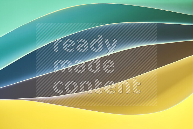 This image showcases an abstract paper art composition with paper curves in green and yellow gradients created by colored light