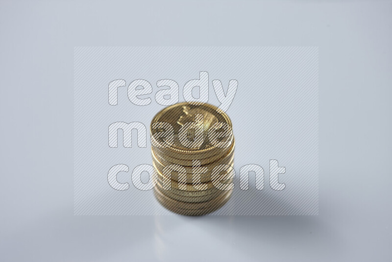 Stack Egyptian 50 piasters coins on grey background