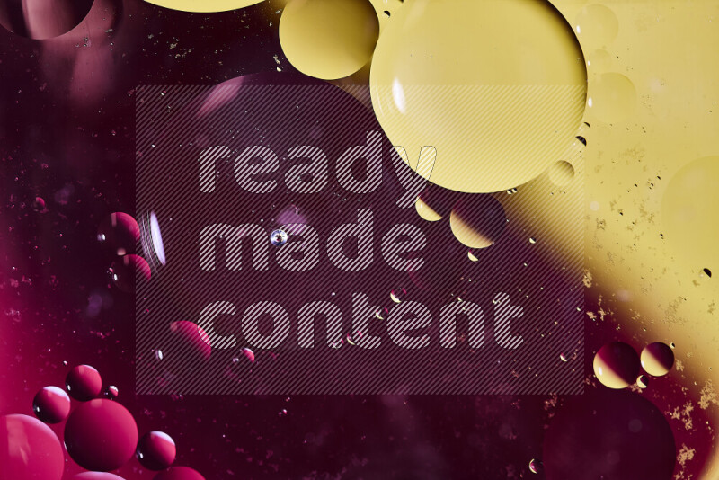 Close-ups of abstract oil bubbles on water surface in shades of red and yellow