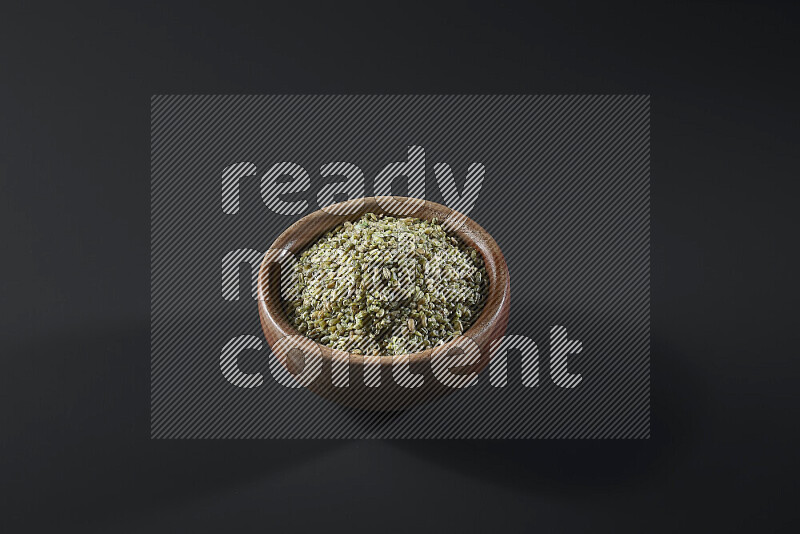 Freekeh in a wooden bowl on grey background