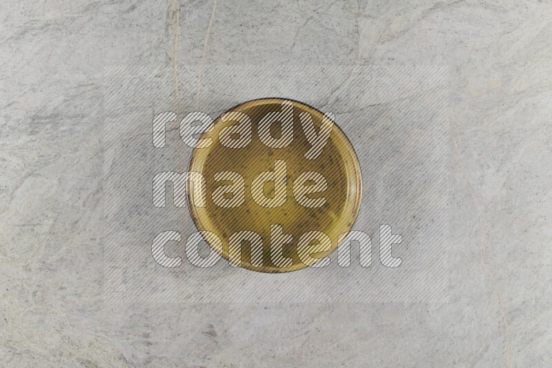 A multicolored pottery Bowl on grey marble background