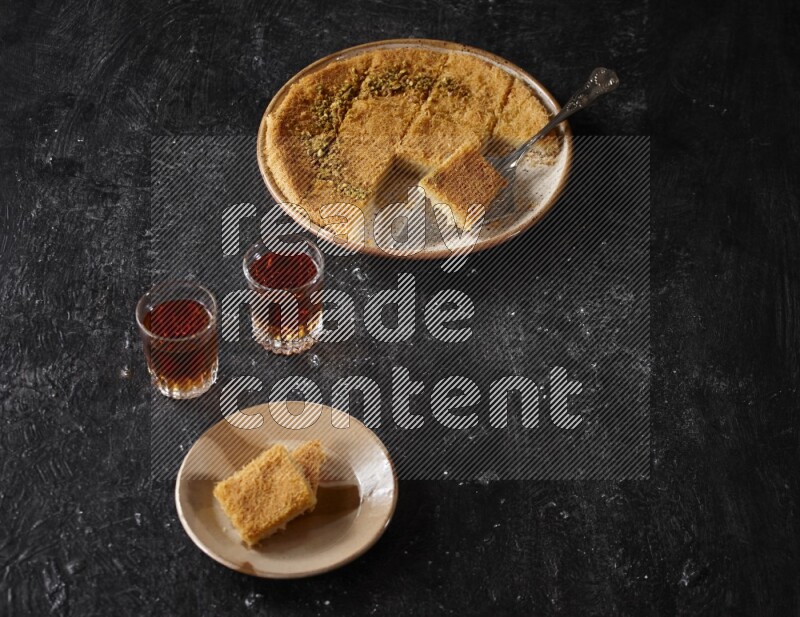 konafa with tea in a dark setup