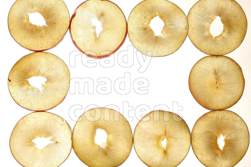 Peach slices on illuminated white background