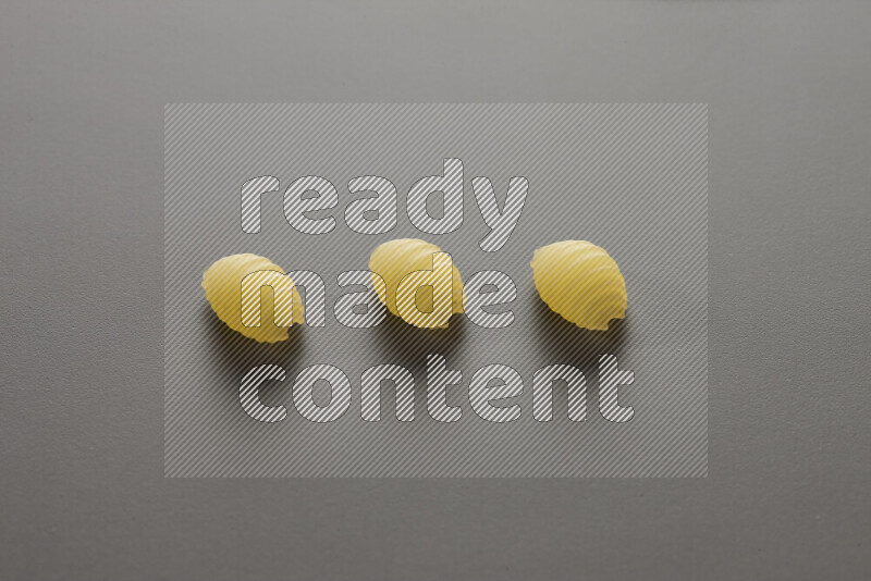 Shells pasta on grey background