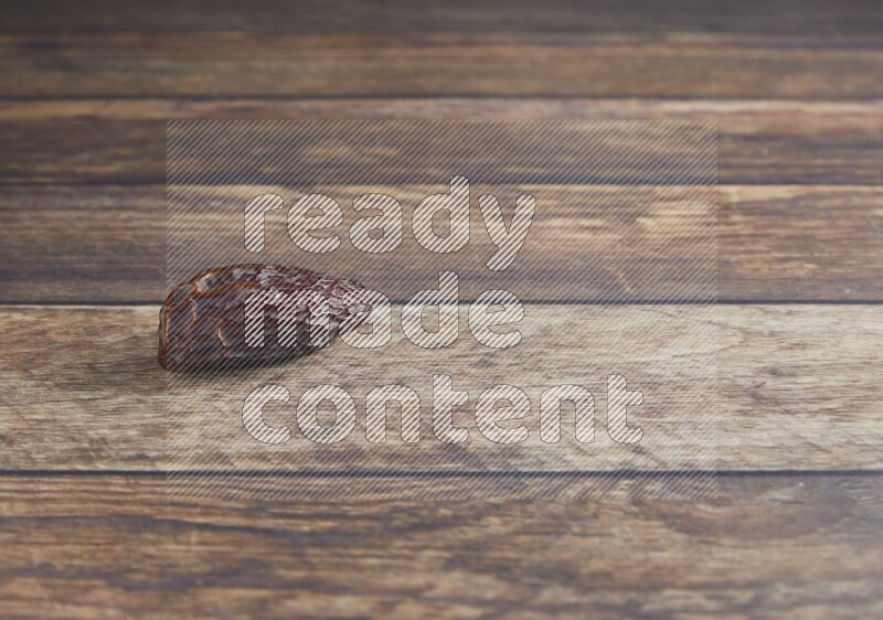 one madjoul date on a wooden background