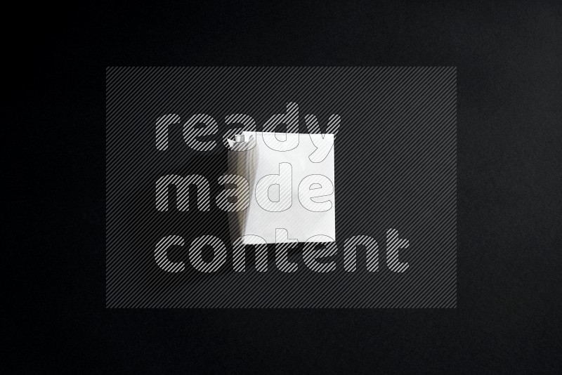 White paper sheet on black background