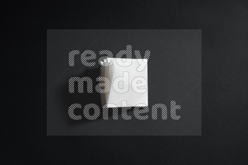White paper sheet on black background