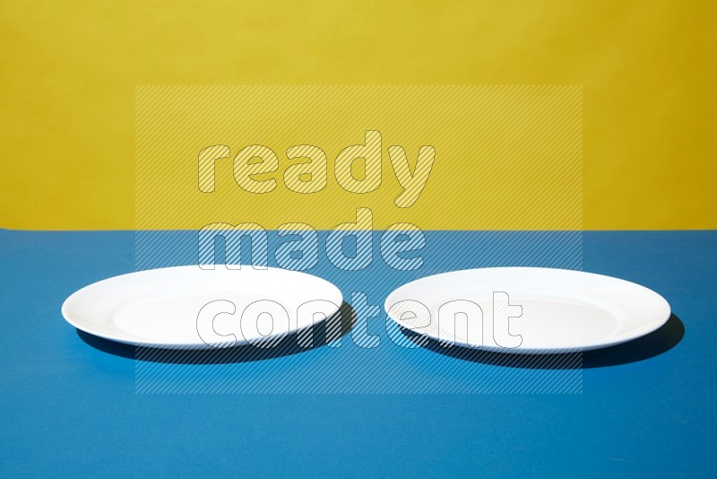 white plate on yellow and blue background