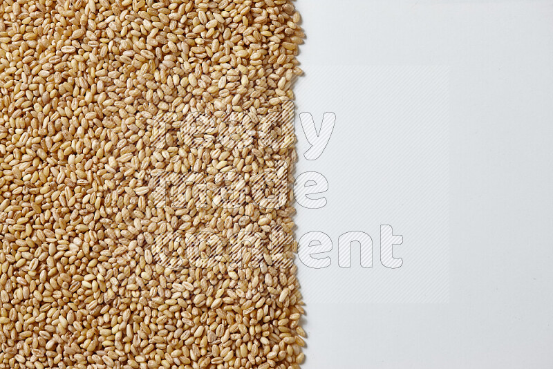 Hulled wheat on white background