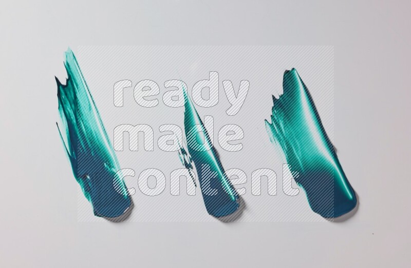 Turquoise painting knife strokes on white background