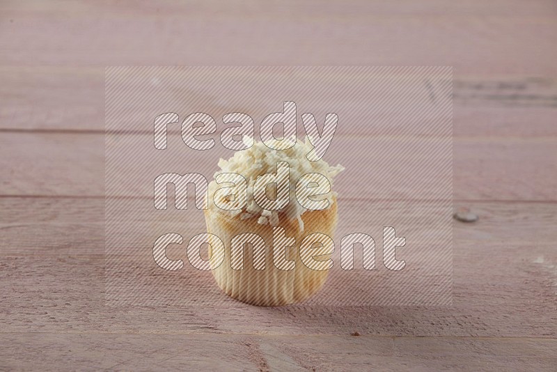 Vanilla mini cupcake topped with coconut