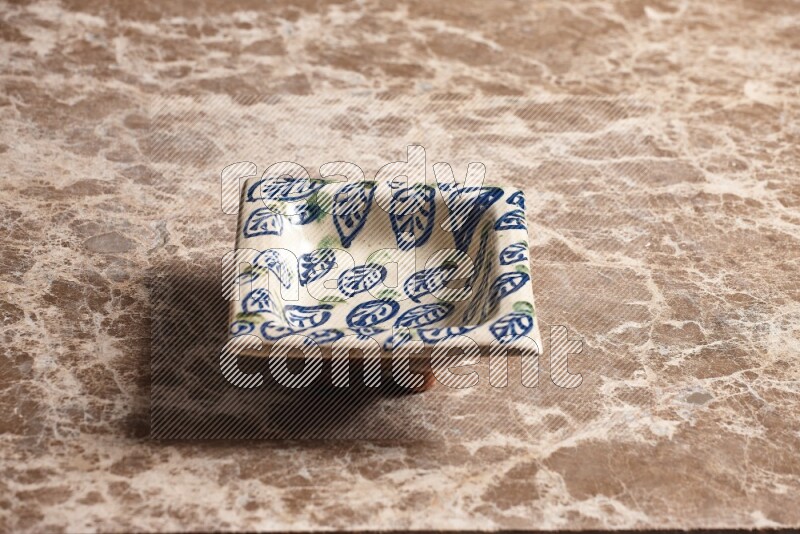 Decorative Pottery Plate on Beige Marble Flooring