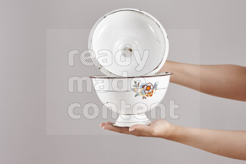 Woman hands holding different metal essentials in different positions