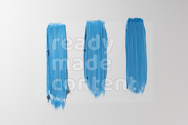 Blue painting brush strokes on white background