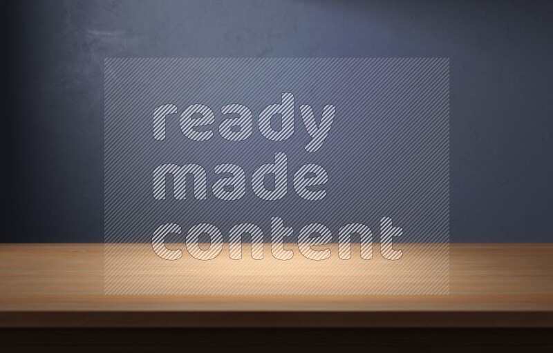 A wooden table top with colored textured wall background