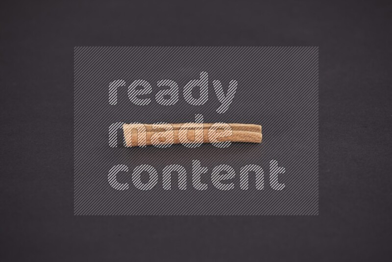 Cinnamon stick on black background