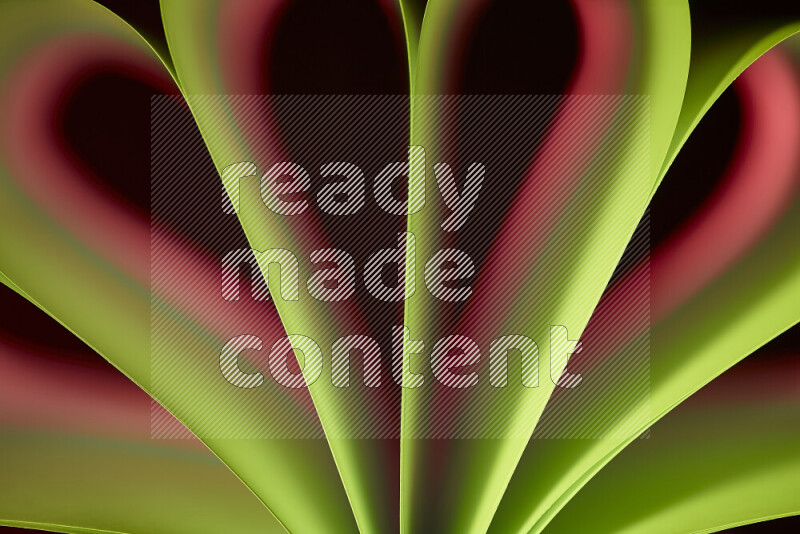 An abstract art piece displaying smooth curves in pink and green gradients created by colored light