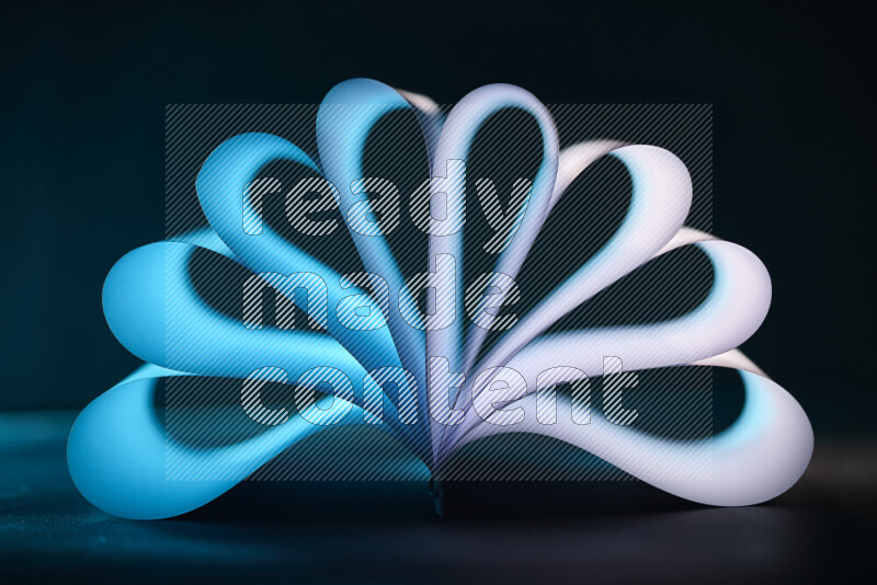 An abstract art piece displaying smooth curves in blue and white gradients created by colored light