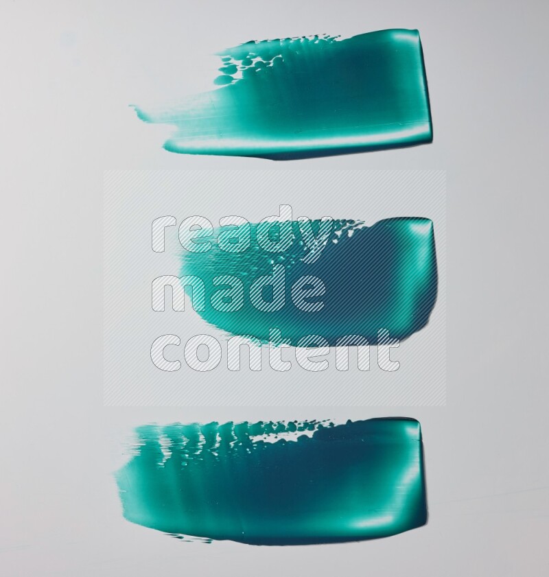 Turquoise painting knife strokes on white background