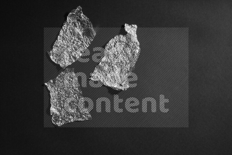 Aluminium foil on black background